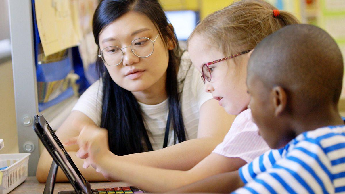 A teacher working with students.