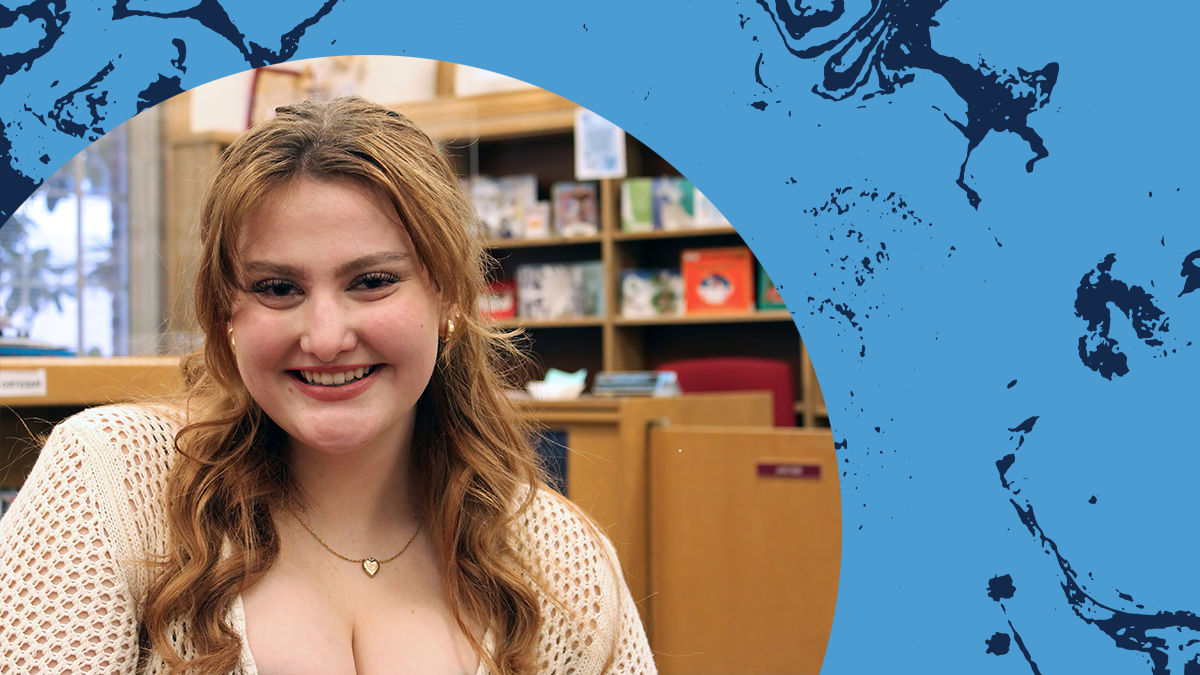 Headshot of Julia Crume against Carolina Blue background.